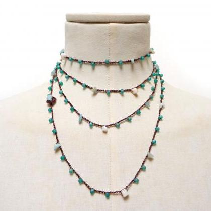 Long Beaded Brown and Green Necklac..
